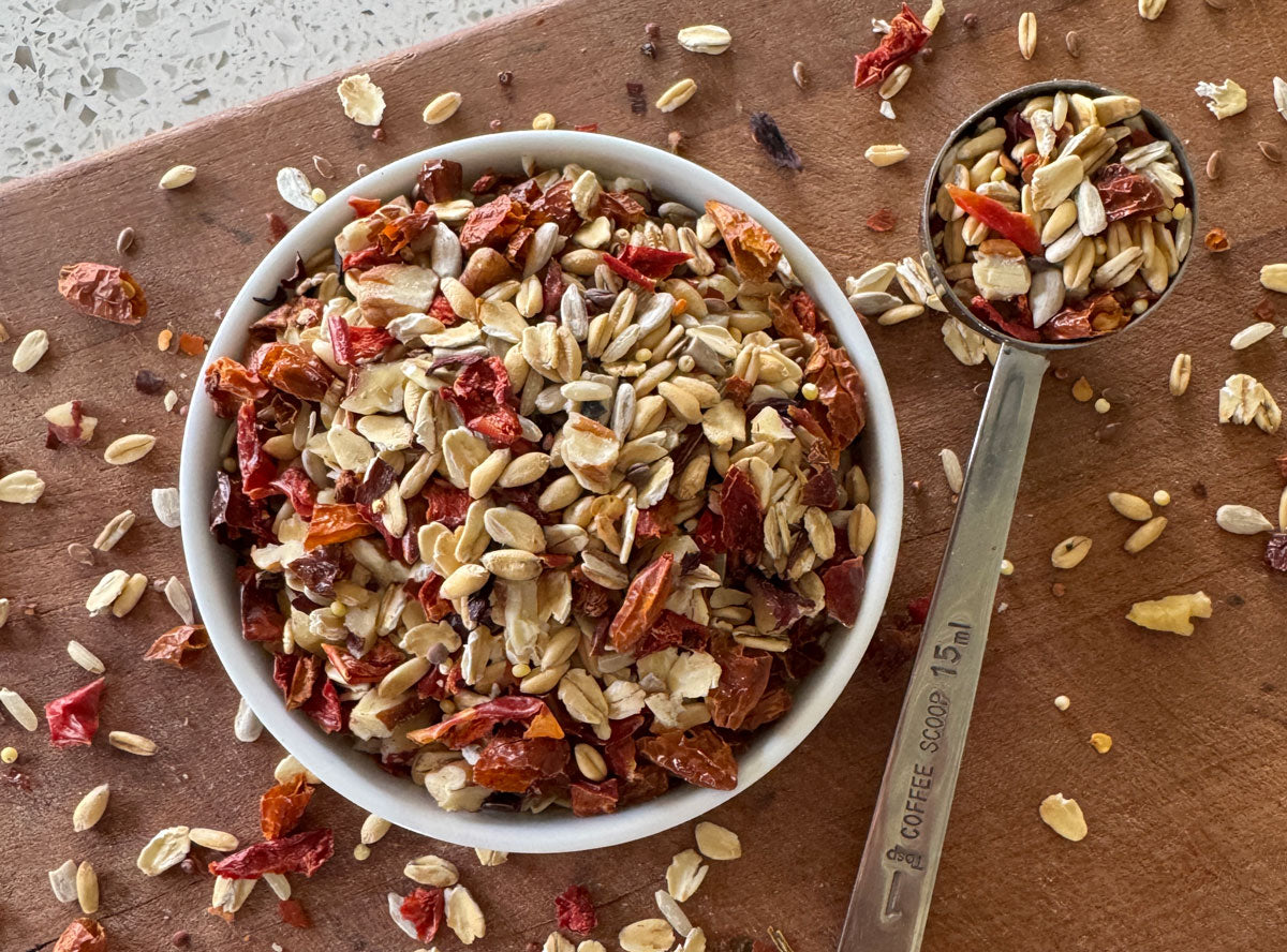 USDA organic parrot food in a shallow bowl showing off all of the individual whole food ingredients.