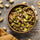 shelled pistachios in wooden bowl