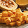 fresh diced pumpkin on a wooden cutting board