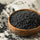 black sesame seeds in a wooden bowl